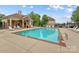Community pool area with lounge chairs, providing a perfect spot for relaxation and recreation at 18339 The Commons Blvd, Cornelius, NC 28031