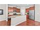 Gourmet kitchen featuring an island, stainless steel appliances, and granite countertops, providing a stylish and functional cooking space at 18339 The Commons Blvd, Cornelius, NC 28031