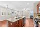 Modern kitchen with a large island, granite countertops, and stainless steel appliances, ideal for cooking and entertaining at 18339 The Commons Blvd, Cornelius, NC 28031