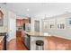 Well-equipped kitchen featuring a granite island, stainless steel appliances, and ample cabinet space, perfect for culinary enthusiasts at 18339 The Commons Blvd, Cornelius, NC 28031