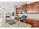Modern kitchen boasts granite counters, stainless steel appliances, and sleek cabinets at 18339 The Commons Blvd, Cornelius, NC 28031
