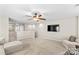 Open loft area with a ceiling fan and neutral color scheme at 18339 The Commons Blvd, Cornelius, NC 28031