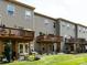 Exterior view of the backyard with a deck, patio and a well-maintained lawn at 1839 Shumard Ln, Charlotte, NC 28205