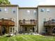A well-maintained backyard featuring a spacious patio and wooden deck with a green lawn and mulit-Gathering architecture at 1839 Shumard Ln, Charlotte, NC 28205