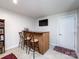 Entertainment area with a bar, stools, TV and beverage storage at 1839 Shumard Ln, Charlotte, NC 28205