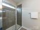 Modern bathroom showcasing a glass-enclosed shower with sleek fixtures and stylish tile work at 1839 Shumard Ln, Charlotte, NC 28205