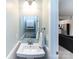 Charming powder room with pedestal sink and modern fixtures, perfect for guests and convenience at 1839 Shumard Ln, Charlotte, NC 28205