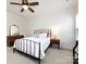 Bright bedroom with comfortable bed, wood floors, and well-lit with natural light from the windows at 1839 Shumard Ln, Charlotte, NC 28205