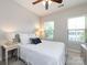 Cozy bedroom featuring natural light, a ceiling fan and soft, neutral tones at 1839 Shumard Ln, Charlotte, NC 28205