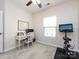Bedroom featuring a desk, chair, exercise bike and a well lit room at 1839 Shumard Ln, Charlotte, NC 28205