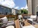 Relaxing deck area with comfortable wicker furniture and an open view of the neighborhood at 1839 Shumard Ln, Charlotte, NC 28205