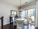 Cozy dining area featuring a round table with seating for four and sliding glass doors to the deck at 1839 Shumard Ln, Charlotte, NC 28205