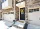 Inviting home entrance with a charming yellow wreath and well-manicured landscaping at 1839 Shumard Ln, Charlotte, NC 28205