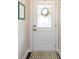 Bright entryway with a stylish white front door and decorative glass panel at 1839 Shumard Ln, Charlotte, NC 28205