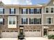 Charming townhouse featuring stone accents, a welcoming entrance, and attached garages at 1839 Shumard Ln, Charlotte, NC 28205