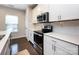 Bright kitchen with white cabinets, stainless steel appliances, and a subway tile backsplash at 1839 Shumard Ln, Charlotte, NC 28205