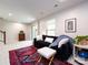 Cozy living room space with comfortable furnishings, a rug and natural lighting at 1839 Shumard Ln, Charlotte, NC 28205