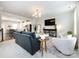 Spacious living room with a TV and open layout leading into the adjacent kitchen at 1839 Shumard Ln, Charlotte, NC 28205