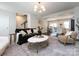 Open-concept living room with a spacious layout and seamless transition to the kitchen at 1839 Shumard Ln, Charlotte, NC 28205