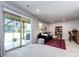 Living room with sliding glass doors to the patio, a bar and a comfortable sofa at 1839 Shumard Ln, Charlotte, NC 28205