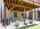 An outdoor patio area with concrete flooring, chairs, and potted plants, creating a cozy atmosphere at 1839 Shumard Ln, Charlotte, NC 28205