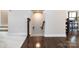 Basement stairway featuring wooden floors and a traditional wooden handrail at 1839 Shumard Ln, Charlotte, NC 28205