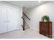 Neutral stairway with carpeted steps, wooden handrail, and a vintage radio at 1839 Shumard Ln, Charlotte, NC 28205