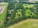 Expansive aerial view showcases lush greenery, a large pool, and a meticulously maintained property at 1878 Pl Propst Rd, Maiden, NC 28650