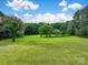 Expansive backyard with lush green lawn, mature trees, and space for outdoor activities at 1878 Pl Propst Rd, Maiden, NC 28650