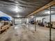 Spacious unfinished basement with a garage door and room for storage or customization at 1878 Pl Propst Rd, Maiden, NC 28650