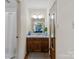 Well-lit bathroom features a marble vanity and a view to the connected bedroom at 1878 Pl Propst Rd, Maiden, NC 28650