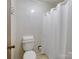 Simple bathroom features a standard toilet, shower and tile flooring at 1878 Pl Propst Rd, Maiden, NC 28650