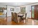 Cozy dining room features a dark wood table, seating for six, and a chandelier at 1878 Pl Propst Rd, Maiden, NC 28650