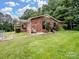 This brick house has a lush green lawn and mature trees at 1878 Pl Propst Rd, Maiden, NC 28650