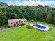 Charming single story brick home with a well-manicured lawn and a backyard pool at 1878 Pl Propst Rd, Maiden, NC 28650