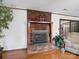 Classic brick fireplace with a wood mantel, complemented by hardwood floors at 1878 Pl Propst Rd, Maiden, NC 28650