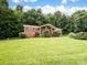 Charming brick home with a well-manicured lawn and inviting front porch at 1878 Pl Propst Rd, Maiden, NC 28650