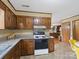 View of the kitchen featuring wood cabinets and granite countertops at 1878 Pl Propst Rd, Maiden, NC 28650