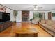 Bright and airy living room boasts hardwood floors, fireplace and comfortable seating at 1878 Pl Propst Rd, Maiden, NC 28650