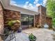 Relaxing outdoor patio area perfect for enjoying the serene surroundings with a brick fireplace at 1878 Pl Propst Rd, Maiden, NC 28650