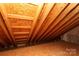 Unfinished attic space with exposed rafters and beams, providing ample storage possibilities at 2018 Rosewater Ln, Indian Trail, NC 28079