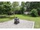 Large backyard featuring a storage shed, fire pit and plenty of green space at 2018 Rosewater Ln, Indian Trail, NC 28079