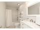 Well-lit bathroom featuring a shower-tub combo and a white vanity with a marble countertop at 2018 Rosewater Ln, Indian Trail, NC 28079