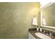 Stylish half-bathroom featuring a granite countertop, decorative wall texture and a modern sink at 2018 Rosewater Ln, Indian Trail, NC 28079