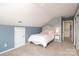 Bedroom featuring neutral walls, carpeted floor, and an attic ceiling next to a bright window at 2018 Rosewater Ln, Indian Trail, NC 28079