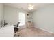 Bedroom featuring neutral walls, carpeted floor, ceiling fan, and shelves above a two-drawer chest at 2018 Rosewater Ln, Indian Trail, NC 28079