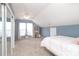 Bedroom featuring neutral walls, carpeted floor, ceiling fan, and closet with mirrored doors at 2018 Rosewater Ln, Indian Trail, NC 28079