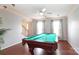 Inviting game room with pool table, hardwood floors, and natural light, open to the foyer at 2018 Rosewater Ln, Indian Trail, NC 28079