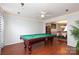 Elegant game room with a pool table, hardwood floors, and bright lighting at 2018 Rosewater Ln, Indian Trail, NC 28079