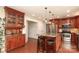 Beautiful kitchen offering a large island with bar seating and stainless steel appliances for modern cooking convenience at 2018 Rosewater Ln, Indian Trail, NC 28079